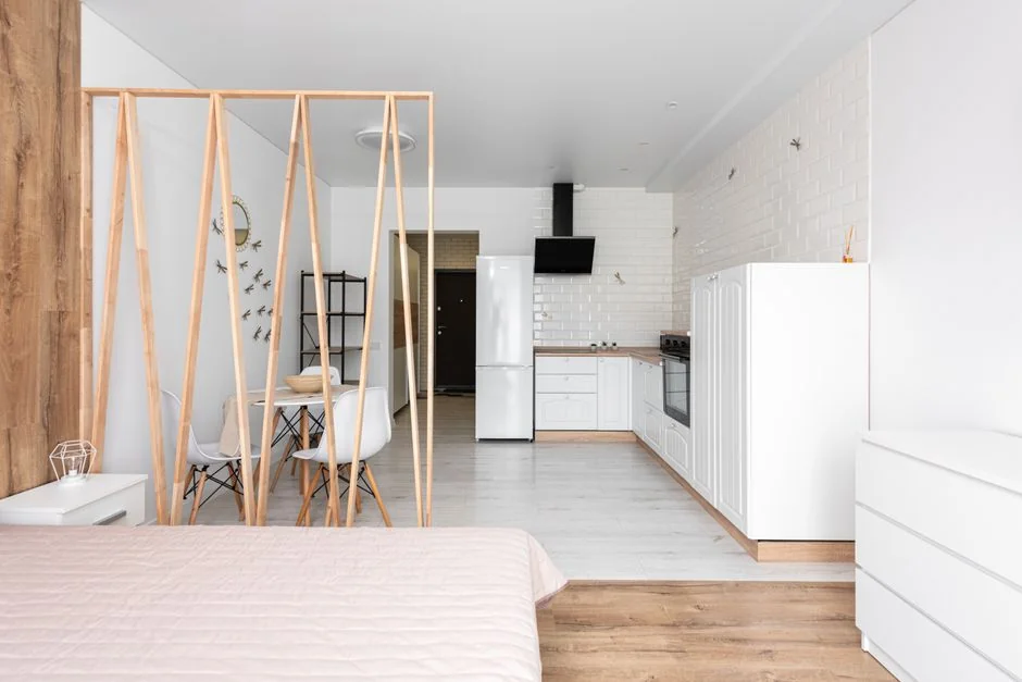Minimalist desk featuring a multipurpose cleaner, office supplies, and storage solutions.